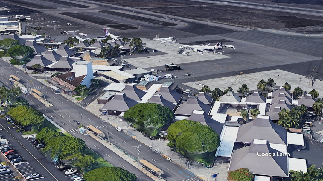 Aerial view of Ellison Onizuka Kona International Airport (KOA) in Hawaii, showing its open-air terminal pavilions, aircraft parking areas, ramp boarding layout, and runway on Big Island.