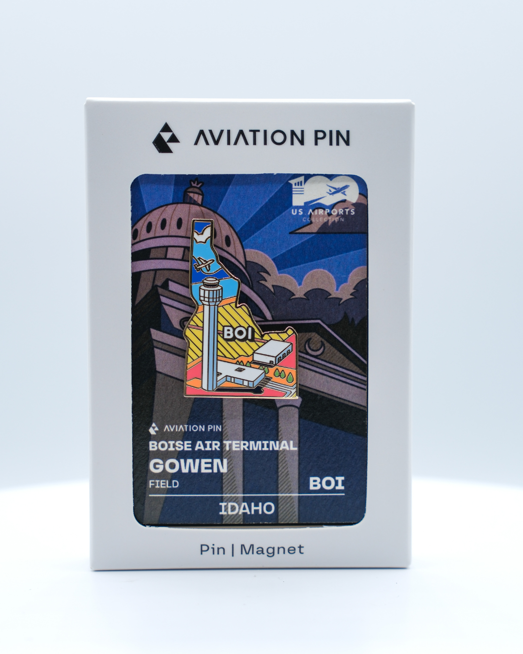 BOI airport pin for Boise Air Terminal / Gowen Field, in its white display box with an illustrated backing card.