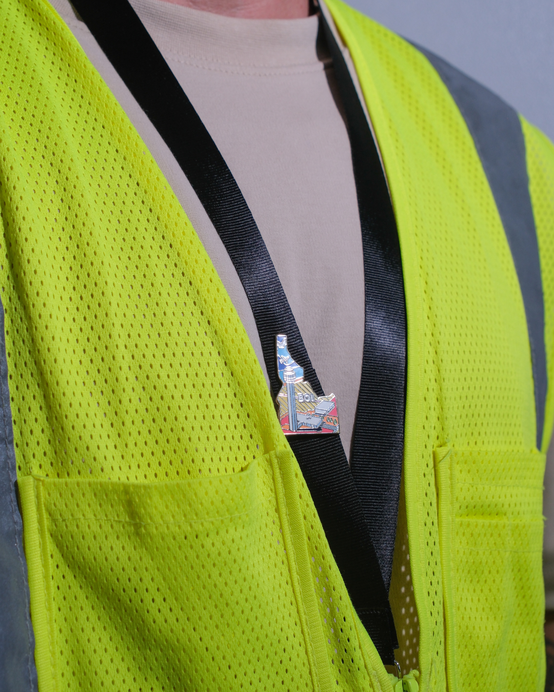 BOI airport pin for Boise Air Terminal / Gowen Field, attached to a black lanyard.