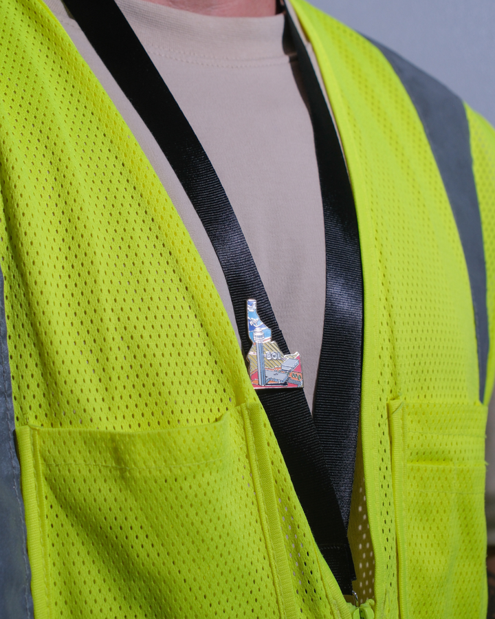 BOI airport pin for Boise Air Terminal / Gowen Field, attached to a black lanyard.